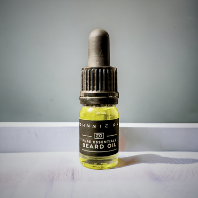5mL bottle of Johnnie Ray Pure Essentials beard oil on white counter