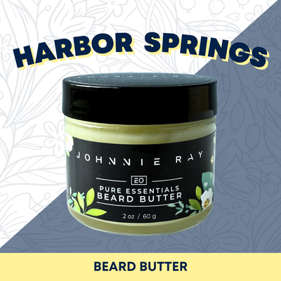 Jar of Johnnie Ray pure essentials beard butter with 'Harbor Springs' branding on a patterned background.