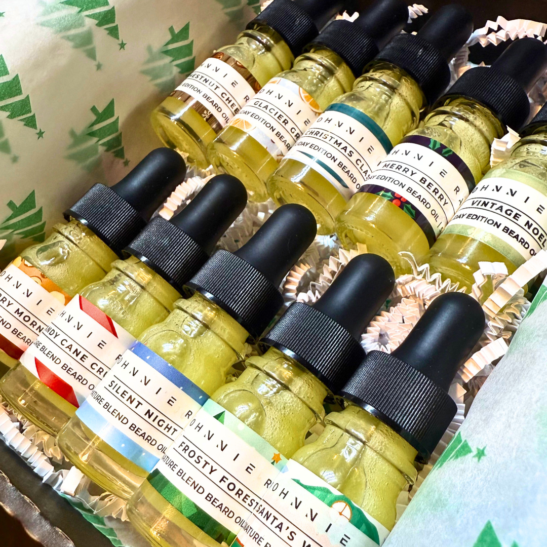 Collection of vintage-themed beard oil bottles with droppers on a decorative background.