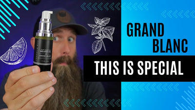 Dan C Bearded holding a bottle of Grand Blanc Beard Oil