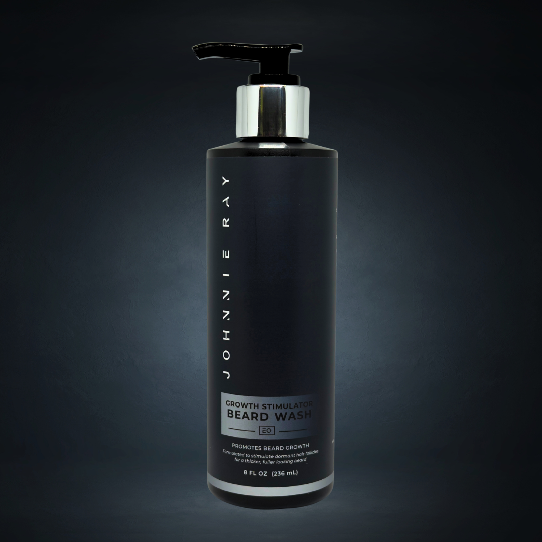 Black bottle of Johnnie Ray beard growth stimulator wash on a dark background