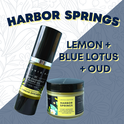 Jar of Johnnie Ray Beard Butter in Harbor Springs scent and bottle of Harbor Springs Beard Oil with a black label with yellow and green floral accents