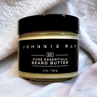 Jar of Johnnie Ray Isle Sleeping Bear Beard Butter stacked on textured grey fabric