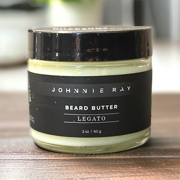 Johnnie Ray Legato Beard Butter from The Rhapsody Collection sitting on a dark wood countertop