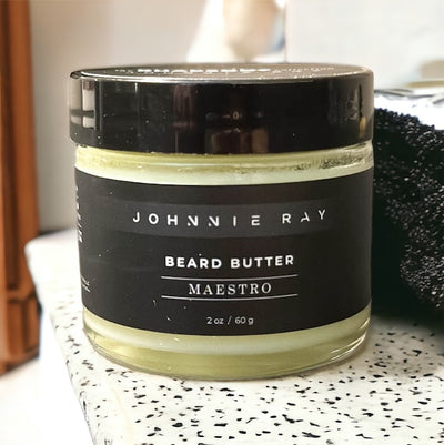 Johnnie Ray Maestro Beard Butter from The Rhapsody Collection sitting on a granite countertop