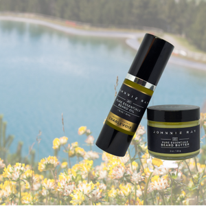 Johnnie Ray Limited Essentials Charlevoix beard oil and beard butter against a floral lake background