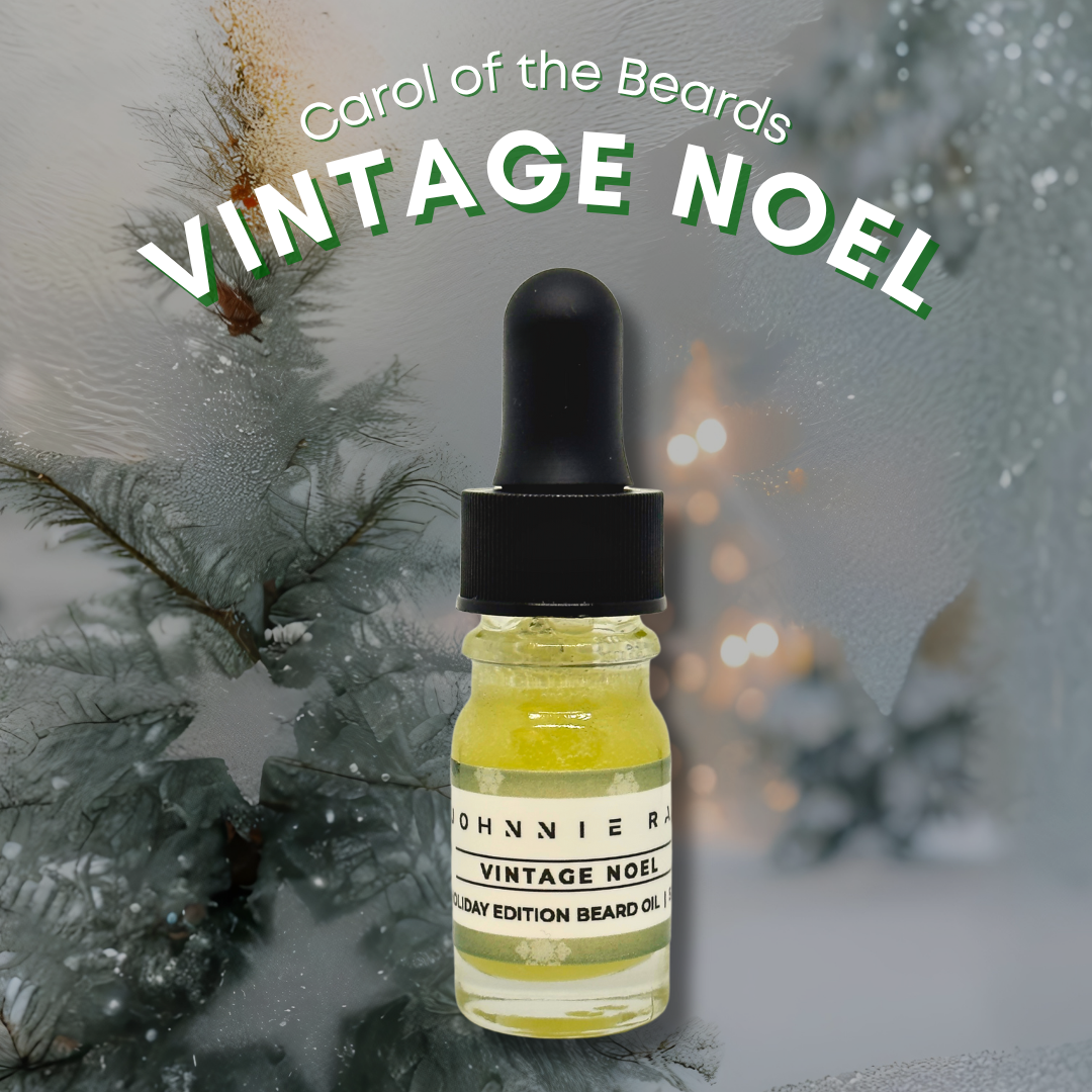 Bottle of 'Vintage Noel' beard oil with Christmas tree and lights in the background